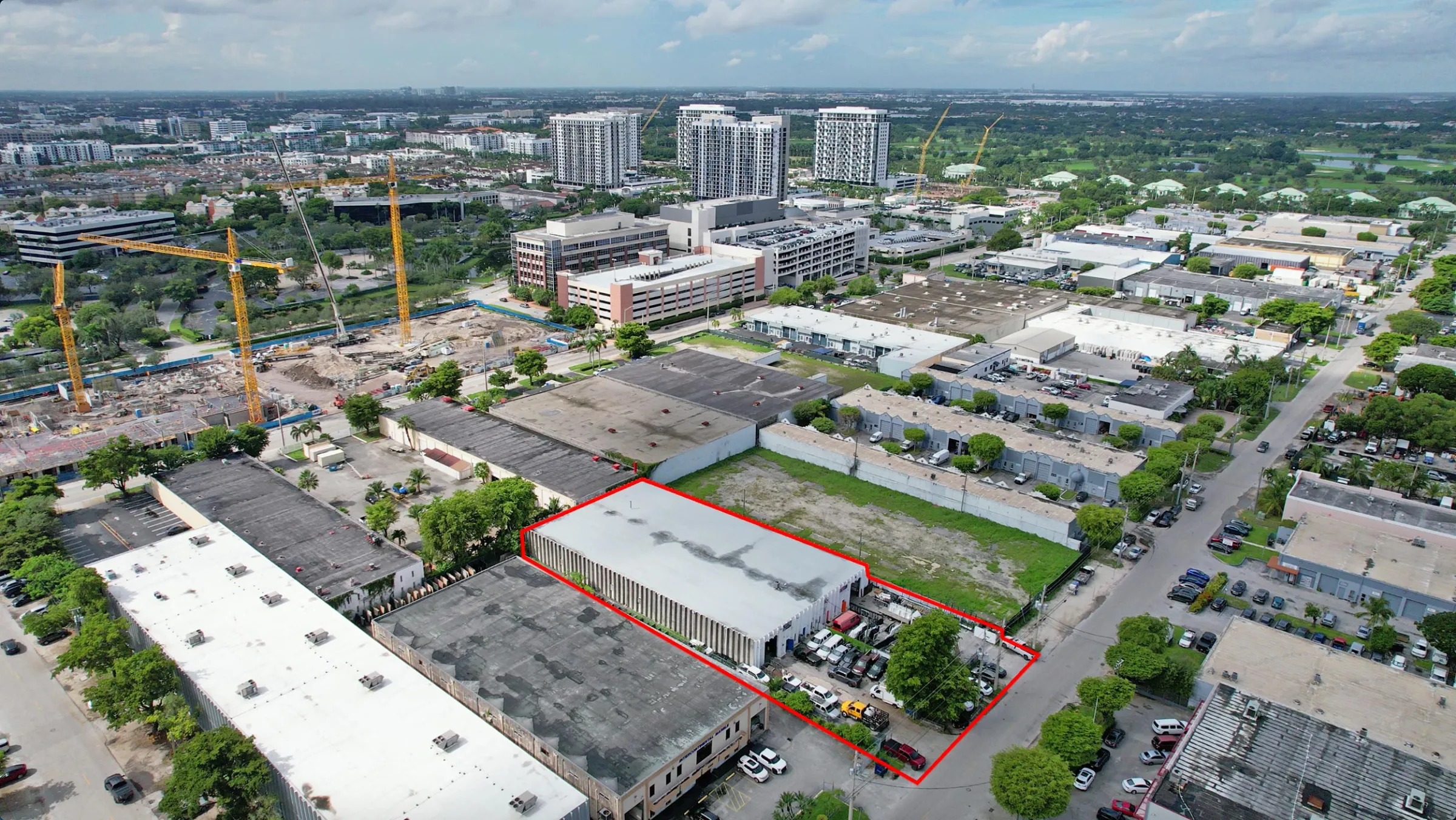 8230 NW 56 St, Doral — industrial, outlined in red in the aerial